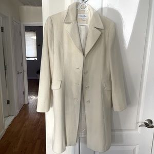 Calvin Klein’s women’s cream colored coat
